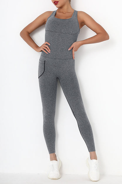 Female model wearing Active Jumpsuit Wide Strap Crisscross Gray