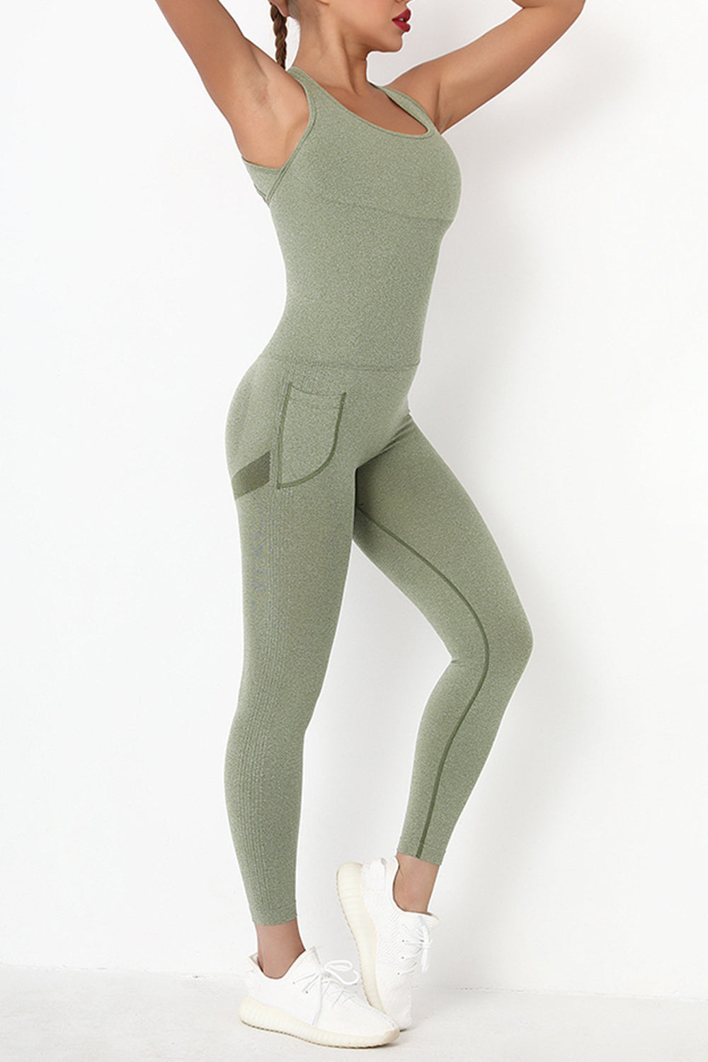 Female model wearing Active Jumpsuit Wide Strap Crisscross Sage