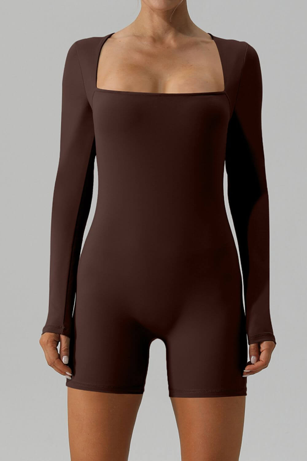 Front-facing image of female model wearing Active Romper Square Neck Long Sleeve Brown