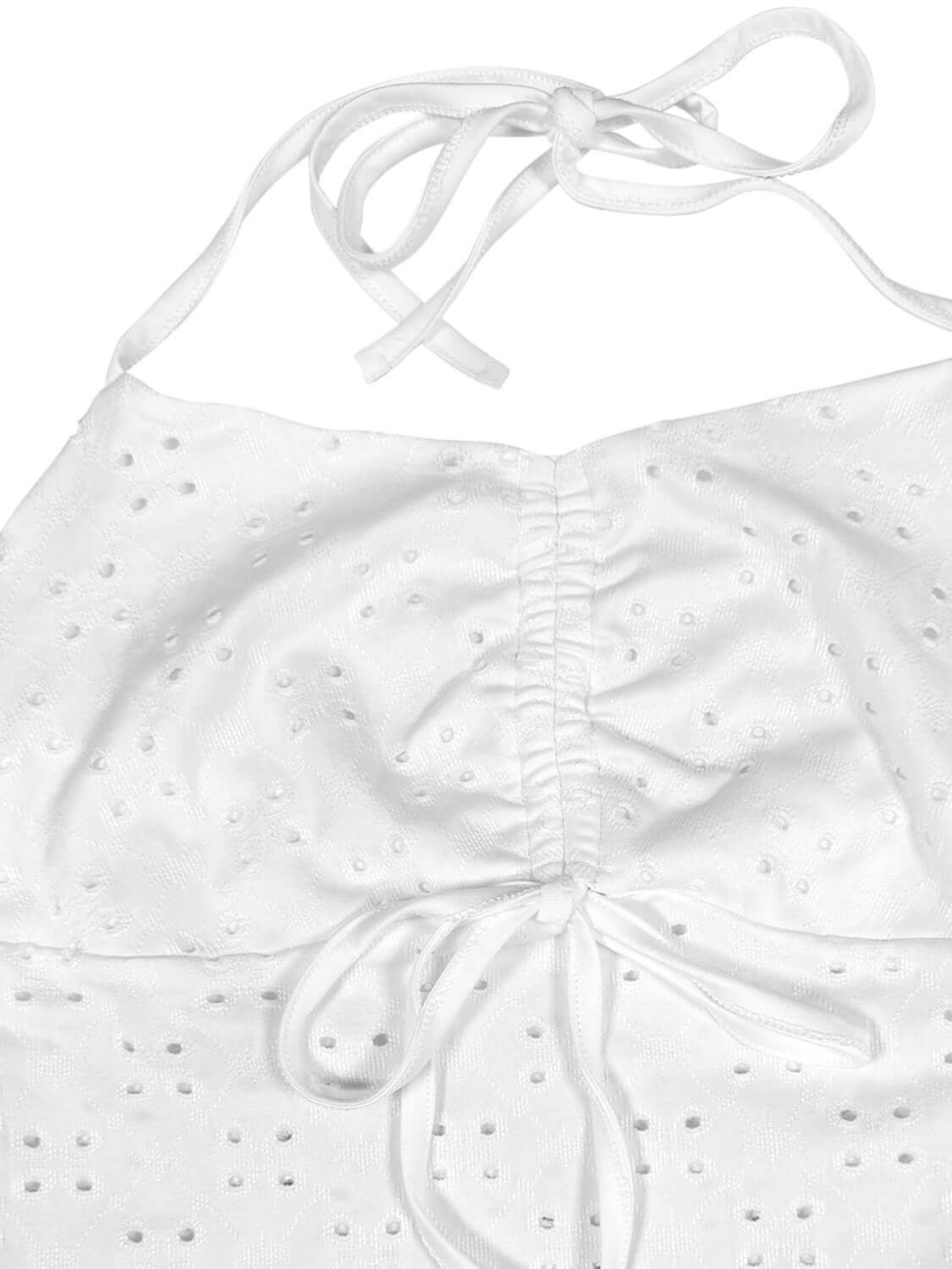 Close-up of the Eyelet Halter Neck Cami showing eyelet detail and tie straps for a stylish summer look.