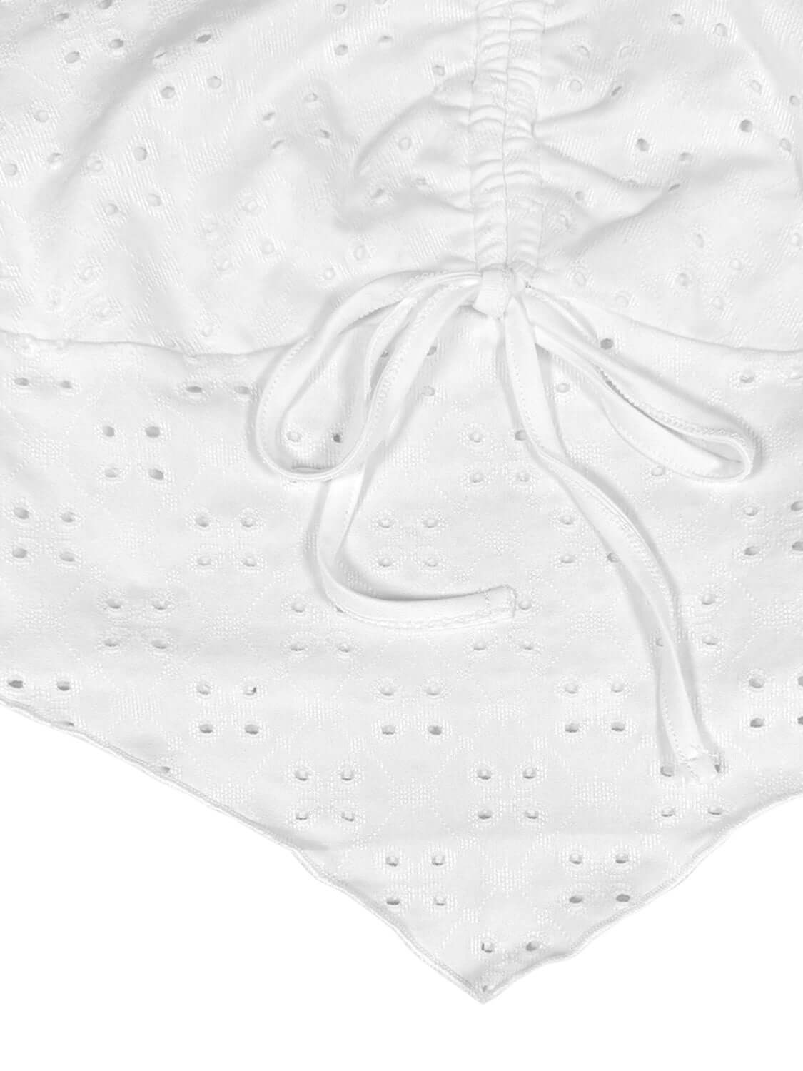 Close-up of the white Eyelet Halter Neck Cami featuring intricate eyelet design and adjustable ties.
