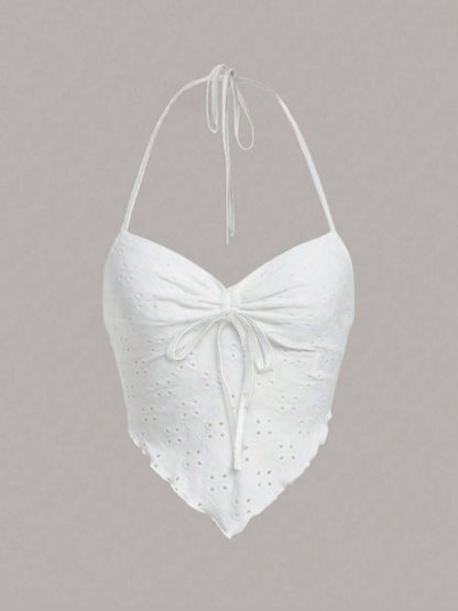 White Eyelet Halter Neck Cami with tie detail and a scalloped hem for a stylish summer look.