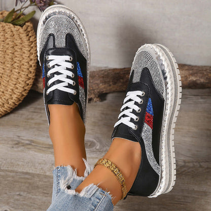 Stylish Rhinestone Sneakers featuring black and silver design, perfect for adding sparkle to any outfit.