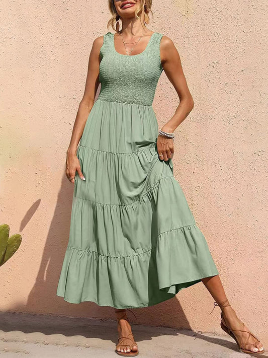 Woman wearing light green tiered dress