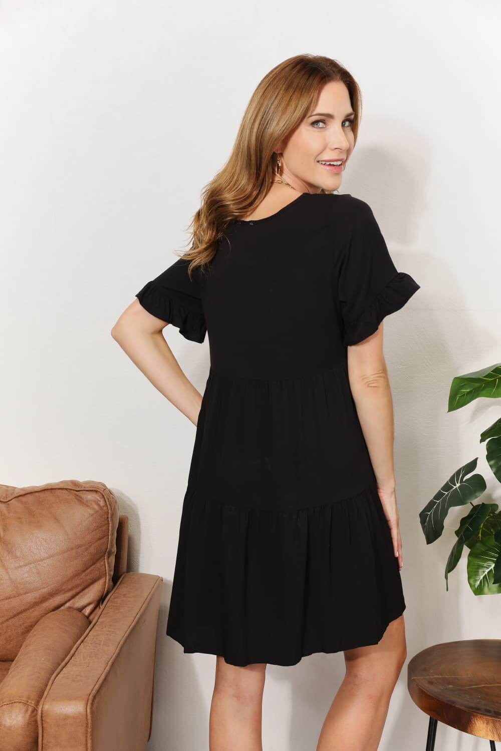 Female model wearing V-Neck Tiered Dress Flounce Sleeve Black