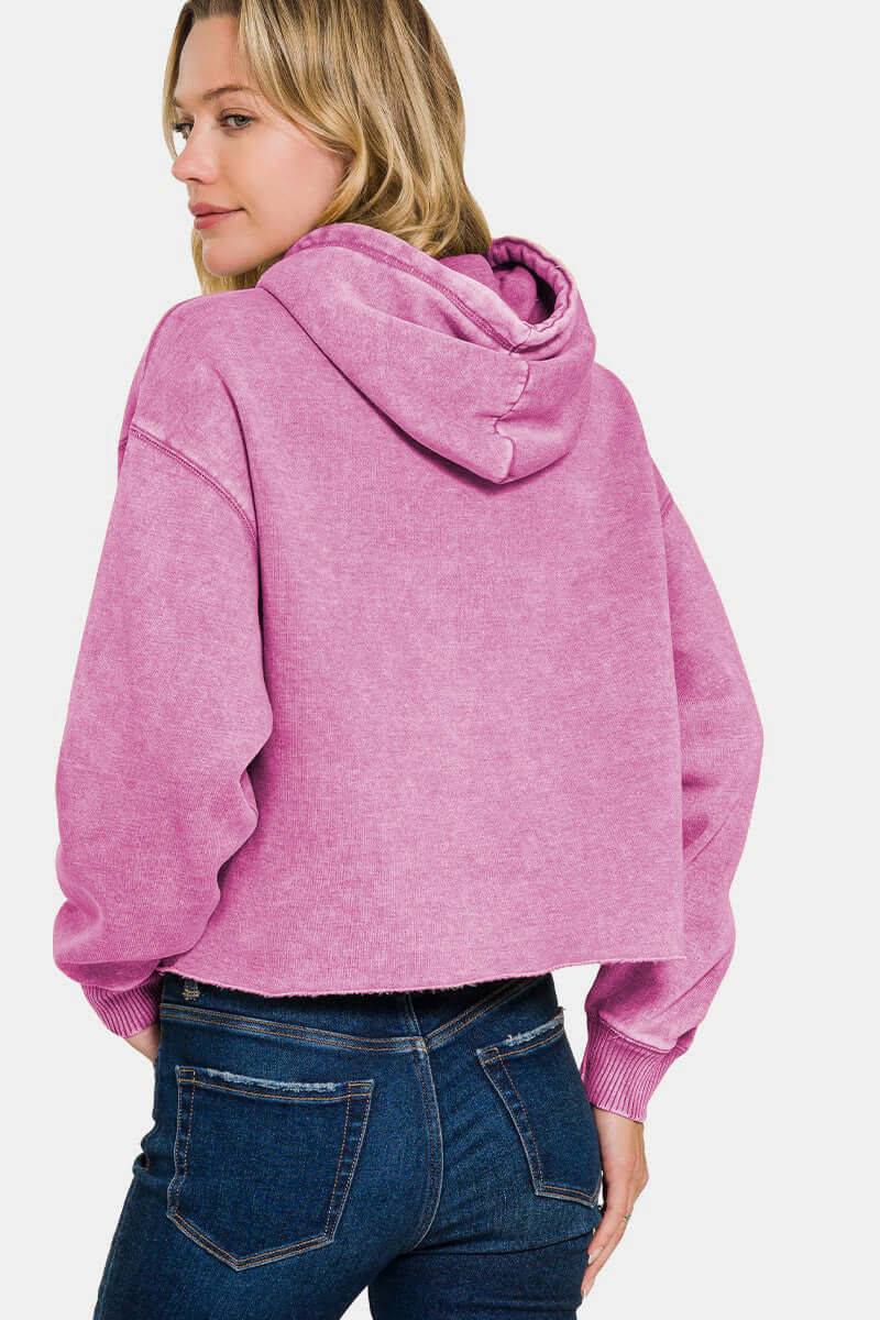 Female model facing backwards wearing a Zenana Acid Wash Hoodie Mauve